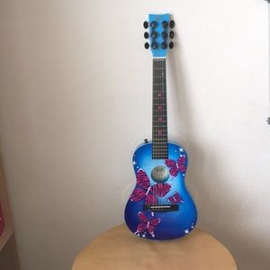 I’m selling a blue guitar with pink butterfly’s